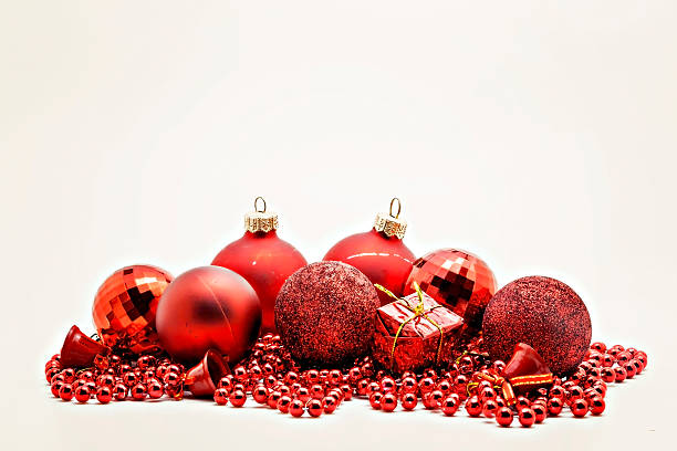 istock red Christmas decoration, balls, beads, bell close up isolated 627919362