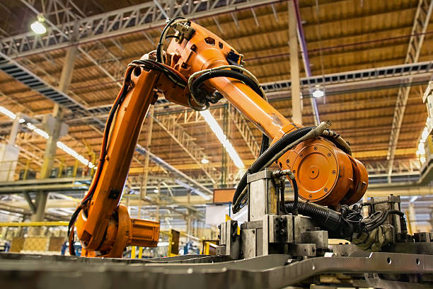 istock Robot arms handle tool keep automotive part to spot machine 627922624