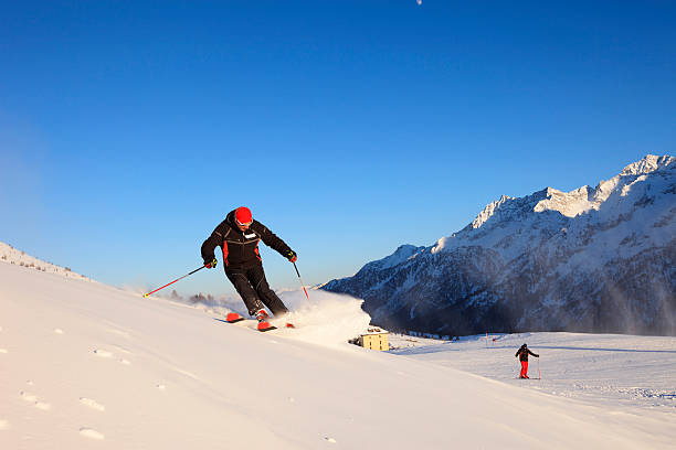 istock Two Men snow skier skiing   Enjoying on sunny ski resorts 627923128