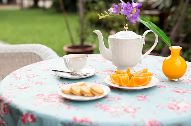 istock Selected focus English tea with orange fruit and biscuit 627930076