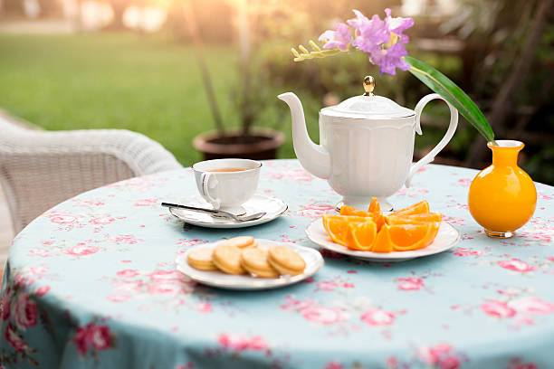 istock Selected focus English tea with orange fruit and biscuit 627930090