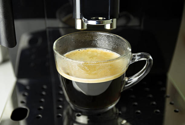 istock Cup of black coffee on coffee machine 627931310