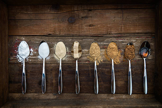 istock Different Kinds of Sugar in the Spoons 627932478