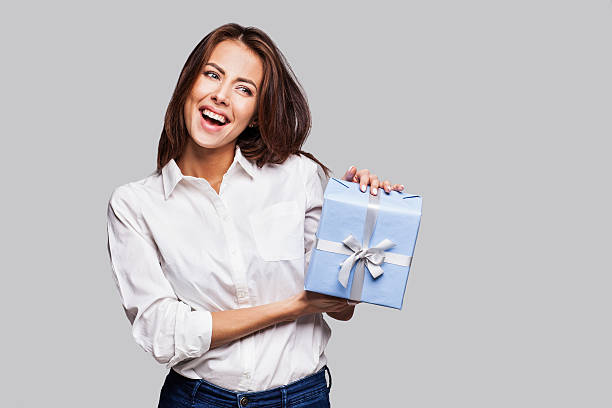 istock Happy woman with a gift 627933700