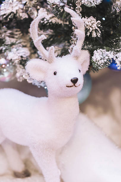 istock White Santa's toy deer, cute Christmas decoration 627941044