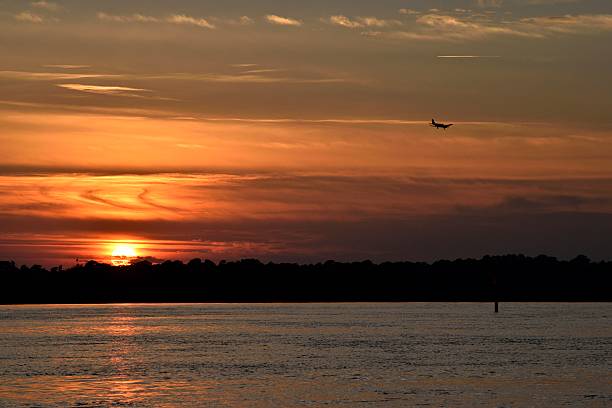 istock Airplane landing at Sunset 627941964