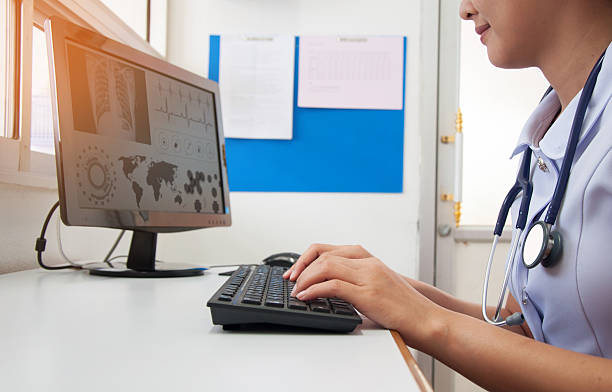istock Doctor working with computer at desk in the hospital 627943260