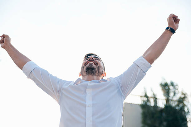 istock Young Man Raising His Arms 627943492