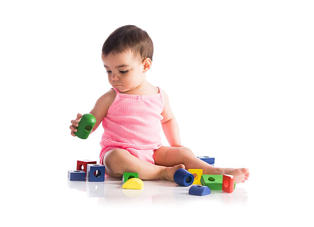 A Toy blocks spelling out the word baby.