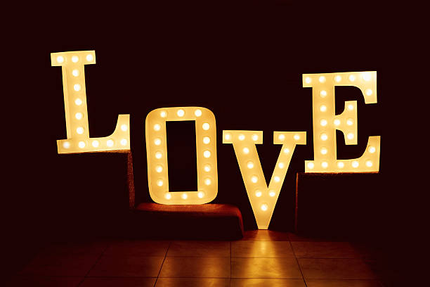 istock word love from big letters with glowing light bulbs on 627949732