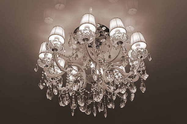 istock large modern chandelier with crystal pendants and glowing bulbs 627950728
