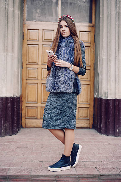 istock girl with phone 627956108