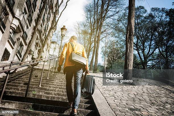 Bearded Man With Suitcase Stepping Up Monmartre Stairs In Paris Stock Photo - Download Image Now