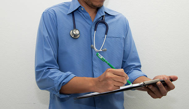 istock Doctor writing a medical prescription 627956988