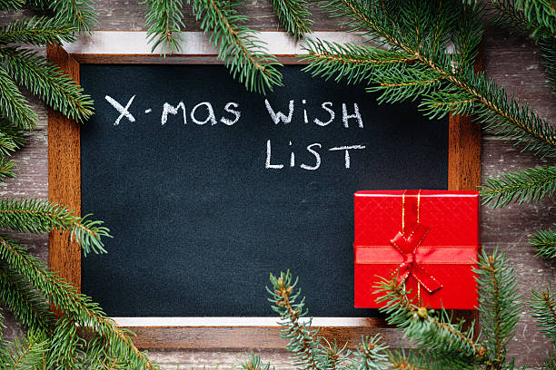 istock Blackboard surrounded by fir branches with text and gift box 627958450