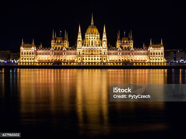 Illuminated Historical Building Of Hungarian Parliament On Danube River Embankment Stock Photo - Download Image Now