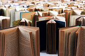 istock Many old books in a row 627965868