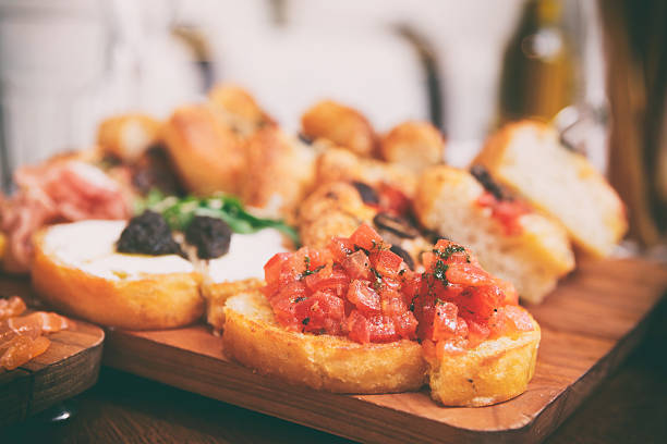 istock Italian appetizers on wooden plank 627966112
