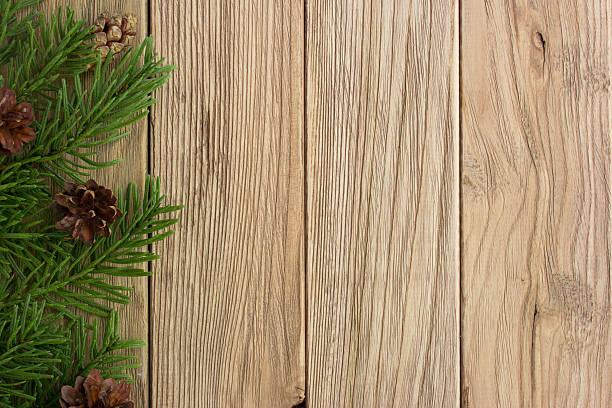 istock Christmas tree and cones on the wooden table 627968158