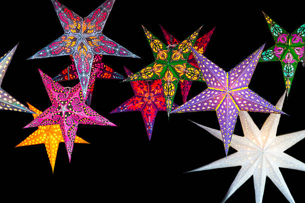 christmas stars decoration on black background in christmas market at Strasbourg