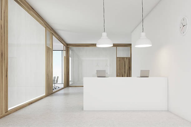 istock Front view of an office lobby with a reception counter 627968380