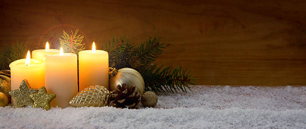 istock Four burning advent candles and Christmas decoration. 627968402