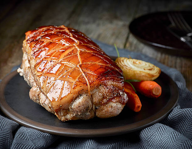 istock roasted pork on wooden table 627968984
