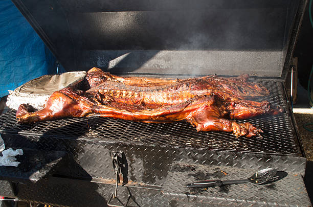 Ready to serve A whole pig is ready to be carved and served at a party on Emerald Isle North Carolina emerald isle north carolina stock pictures, royalty-free photos & images