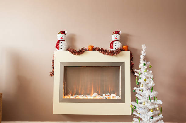 istock Snow man at christmas fire decoration 627974686