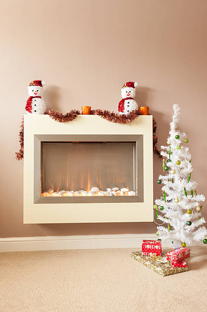 istock Snow man at christmas fire decoration 627974970