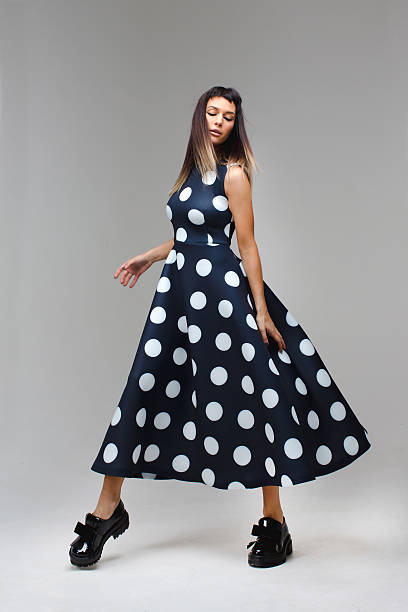 istock Model in a long polka dot dress dance 627975568