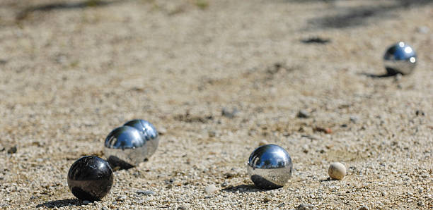 istock Metallic petanque three balls and a small wood jack 627975824