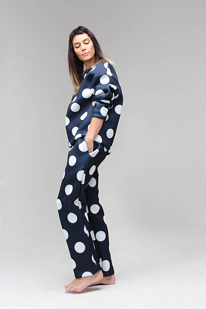 istock Model posing in a polka dot costume pajamas 627976716