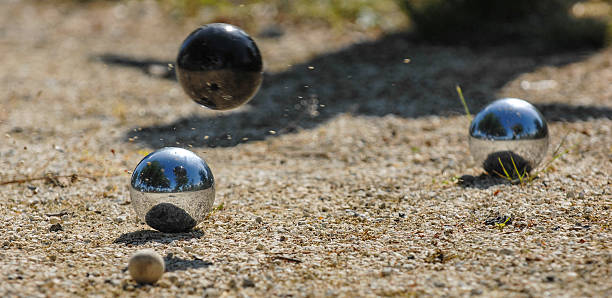 istock Metallic petanque three balls and a small wood jack 627983588