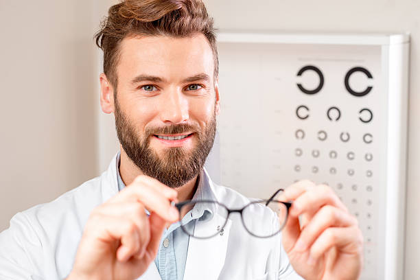 istock Eye doctor with glasses 627983664