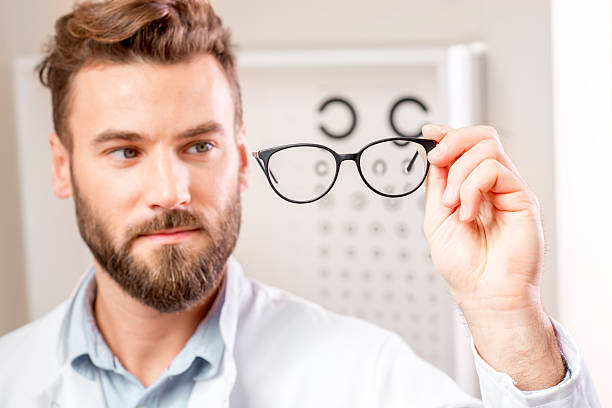 istock Eye doctor with glasses 627984174