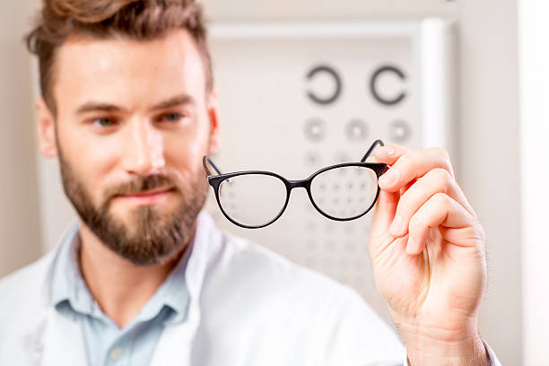 istock Eye doctor with glasses 627984260
