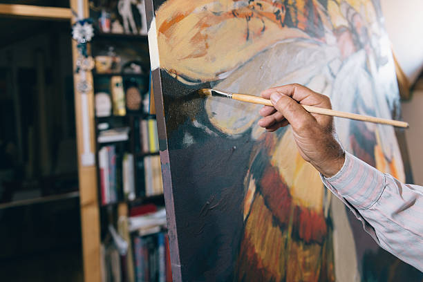 istock Artist painting in his workshop 627987048