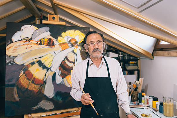 istock Artist painting in his workshop 627987492