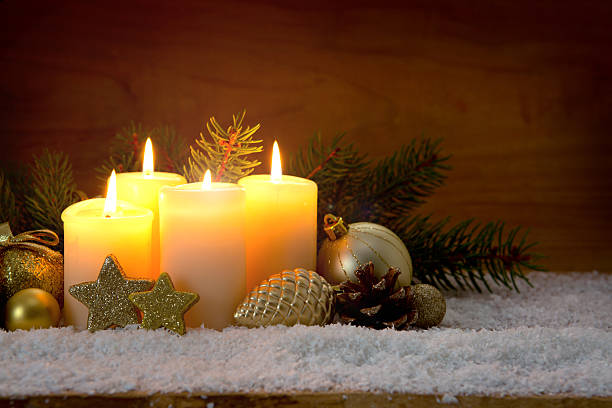 istock Four burning advent candles and Christmas decoration. 627992304