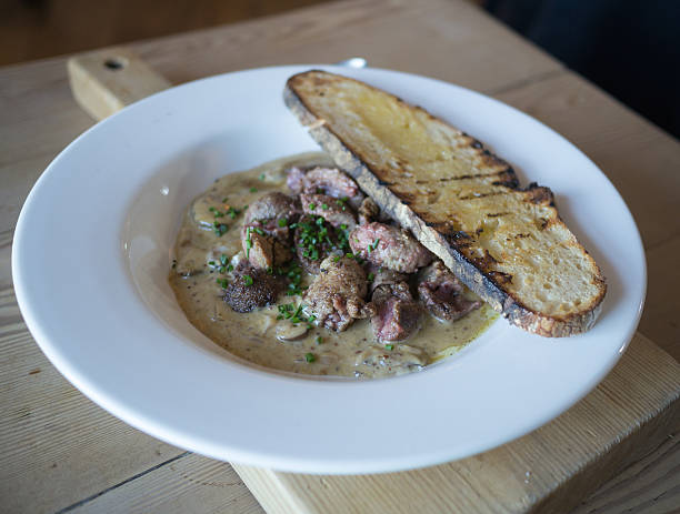 Lambs liver served with mushrooms and bread