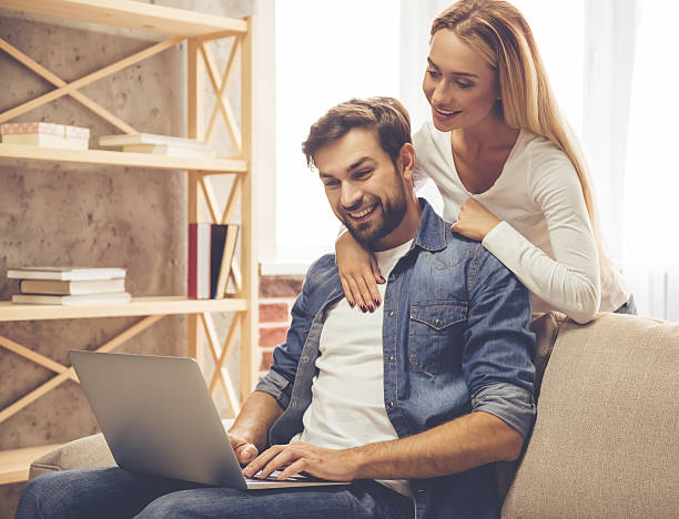 istock Happy couple with gadget 627994384