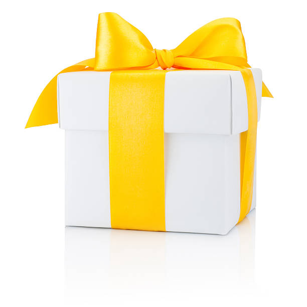 istock White gift box tied yellow ribbon Isolated on white background 627995438