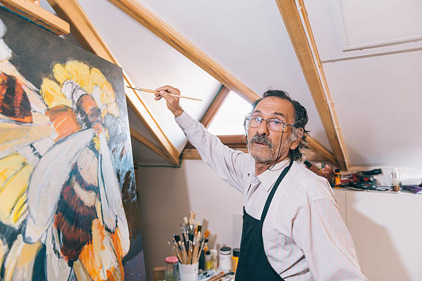 istock Artist painting in his workshop 627995492