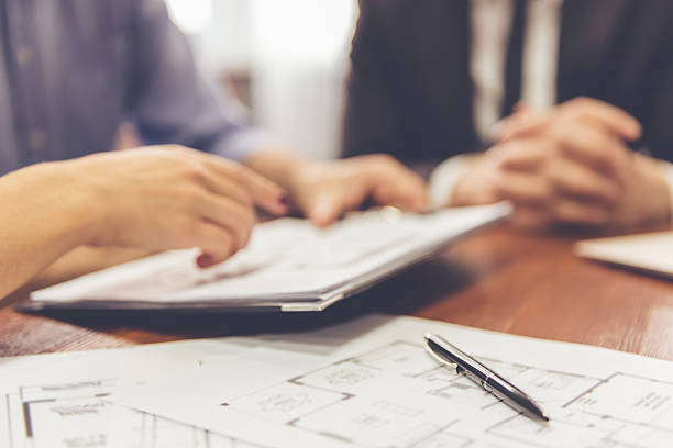 istock Couple and a Real Estate Agent 627996084