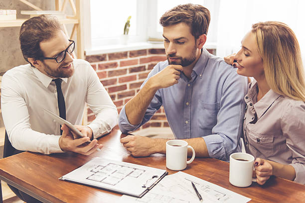 istock Couple and a Real Estate Agent 627996258
