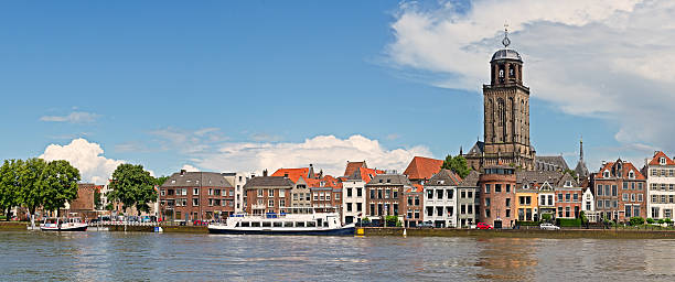 Panoramic view of the medieval Dutch city Deventer Panoramic view of the medieval Dutch city Deventer with the Great Church of Lebuinesker alongside the IJssel river deventer photos stock pictures, royalty-free photos & images