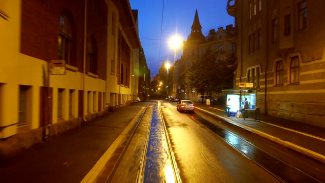 View from train ride at night Helsinki, residential houses at Katajanokka