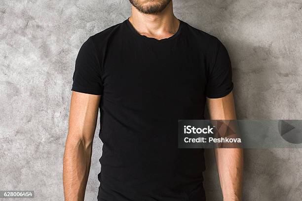 Man In Black Shirt Closeup Stock Photo - Download Image Now - Adult, Advertisement, Arts Culture and Entertainment