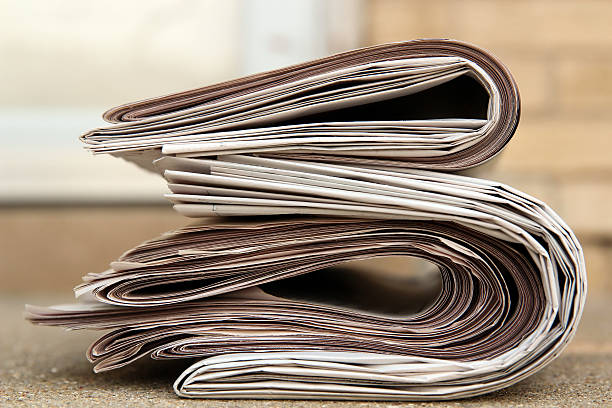 istock Pile of newspapers on a stairs 628006492